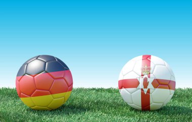 Yeşil çimlerin üzerinde bayraklı iki futbol topu. Almanya ve Kuzey İrlanda. Euro 2020. C Grubu 3D resim
