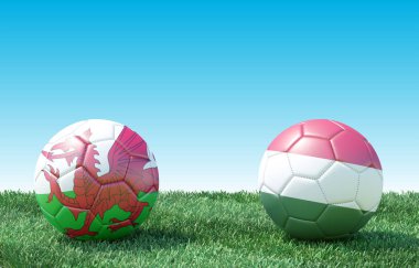 Yeşil çimlerin üzerinde bayraklı iki futbol topu. Galler ve Macaristan. Euro 2020. E Grubu 3D resim