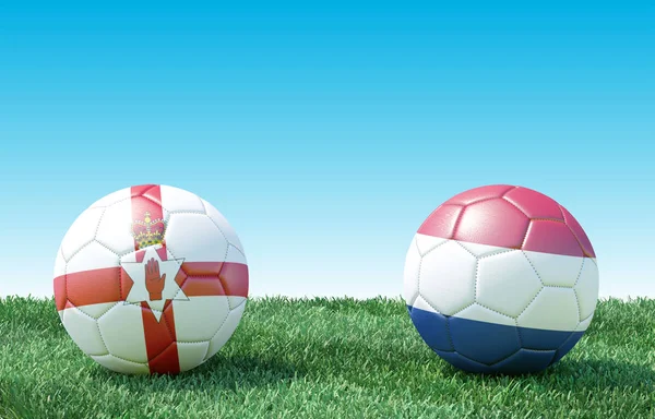 Two soccer balls in flags colors on green grass. Northern Ireland and Netherlands. EURO 2020. Group C. 3d image