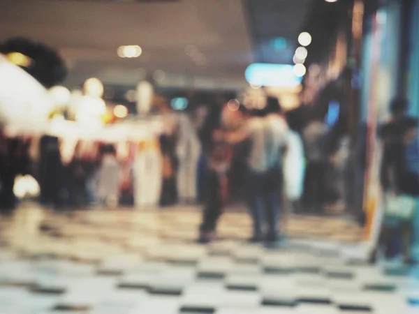 Blurred background with walking people in mall