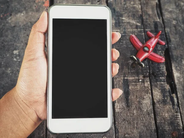 El ve oyuncak uçak akıllı telefon