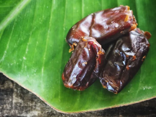 Date fruit on banana leaf