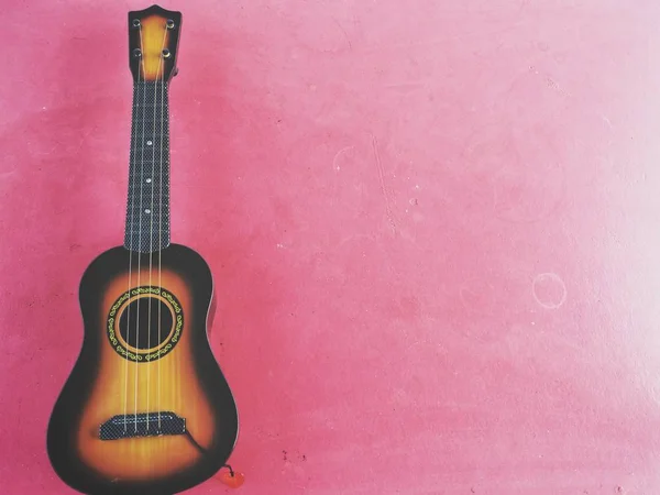 Ukelele Guitarras Sobre Fondo Rosa — Foto de Stock