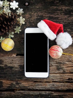 Noel şapka ile akıllı telefon