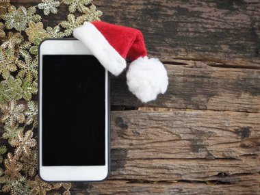 Noel şapka ile akıllı telefon