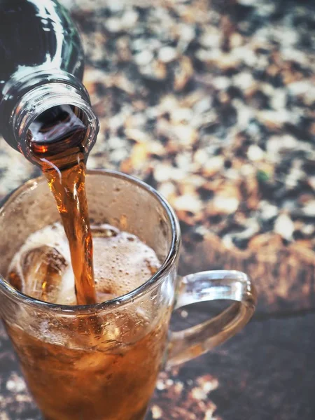 Pouring cola drink on glass — Stock Photo, Image