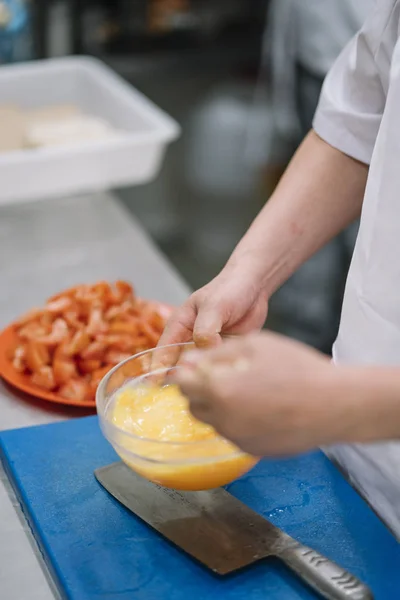 Asian chef works in the kitchen wok restaurant