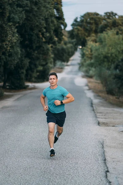 Classic vintage man does sport and runs in the field.