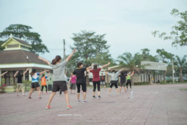 Men with women dancing aerobics Exercise good health Is blurry