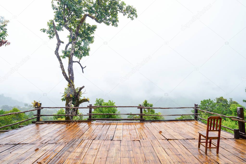 Patio and chair wood Mountain View in Asia, Doi Luang Chiang Dao Chiang Mai Thailand After rain, there is a fog float, covered with green forest, mountain air fresh air landscape nature concept