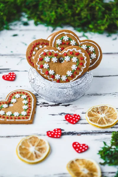 Gingerbread Cookies hearts in a cup on a white wooden background. Valentines day concept Copy space