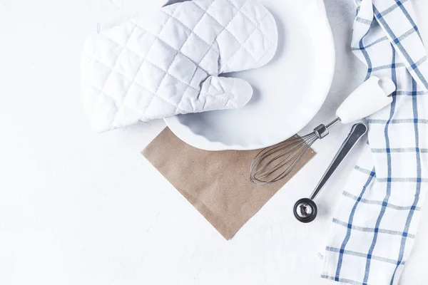 dishes and kitchen accessories for baking on the Kitchen table on a white background Copy space