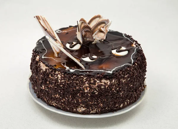 kanatlar, toz, hafif bir arka plan üzerinde brown ile çikolatalı kek