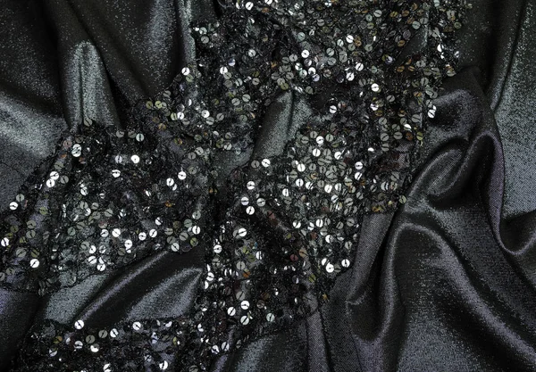yumuşak pullu siyah parlak kumaş kıvrımları