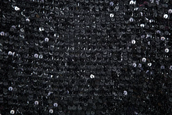 örme olarak yuvarlak siyah pullu kumaş