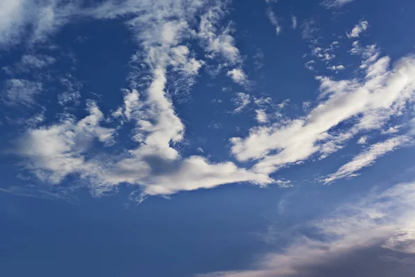 Puffy clouds on blue sky