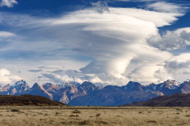 Dramatic Lenticular cloud over the Andes mountain range clipart
