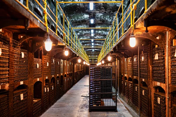 stock image Large modern wine storage, many bottles and boxes of wine.