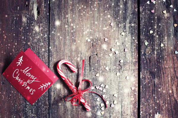 Cane Caramelo Navidad Con Arco Rojo Aislado Sobre Fondo Madera —  Fotos de Stock