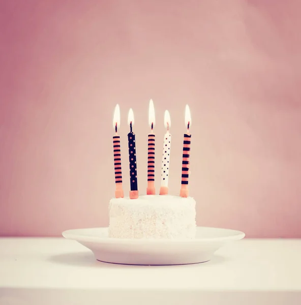 Birthday cake with candles in vintage style, copy space