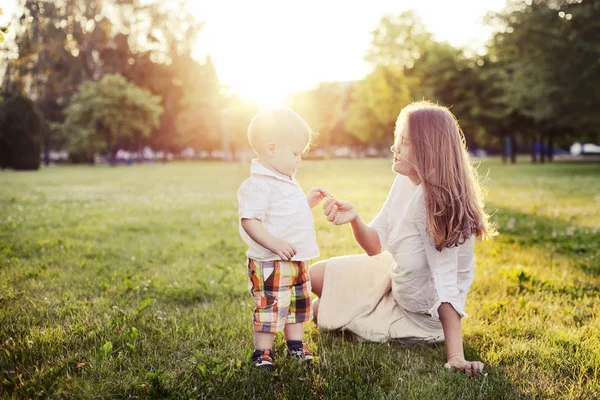 Happy Toddler Boy Relaxing Green Grass Mother Sunny Park — Stock Photo, Image