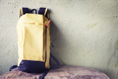 closeup view of schoolbag against rustic wall  clipart
