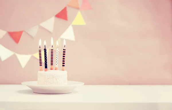 Birthday cake with candles in vintage style, copy space