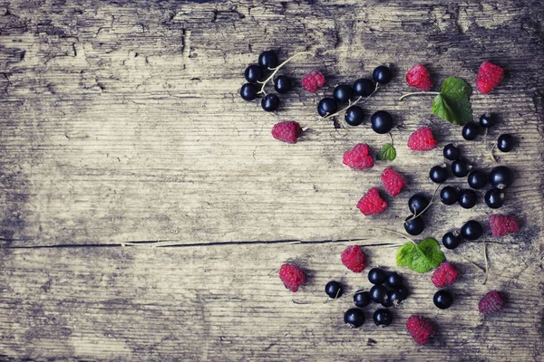 Fresh Ripe Raspberries Black Currants Scattered Grey Wood — Stock Photo, Image