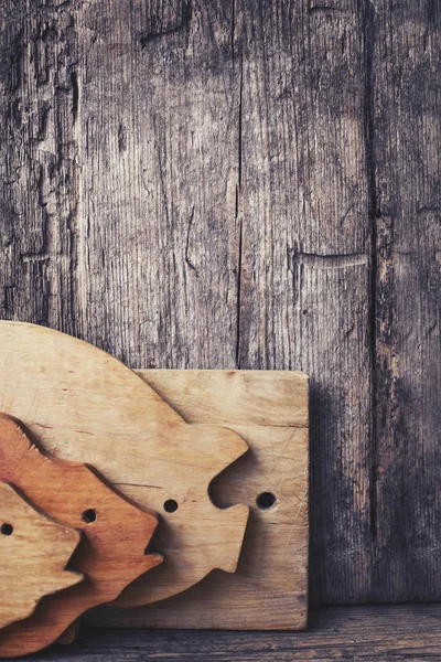 cooking chopping boards in animal representation over wooden background