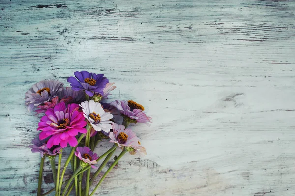 bright field flowers on wooden rustic surface