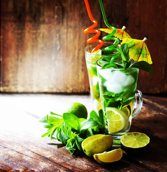 mojito cocktails with decoration on wooden table