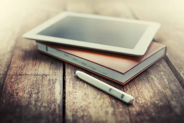 closeup view of digital tablet lying on wooden table