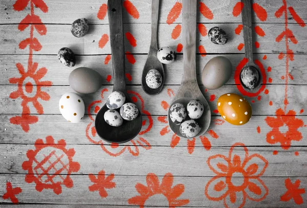 festive easter decorations with drawing floral ornaments on wooden table