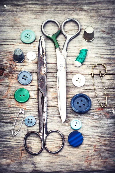 Vintage sewing tools on wooden table