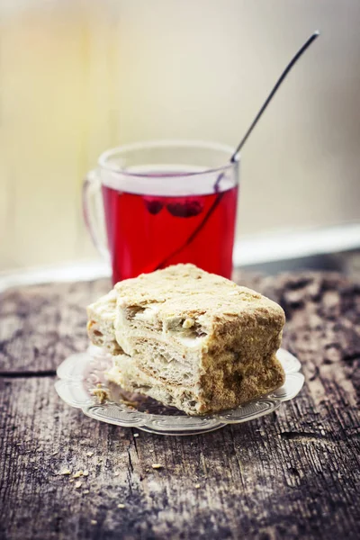 Cake with cup of hot fruite tea — Stock Photo, Image