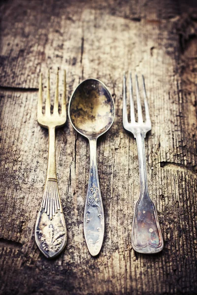 Vintage spoon and forks with blue bow — Stock Photo, Image