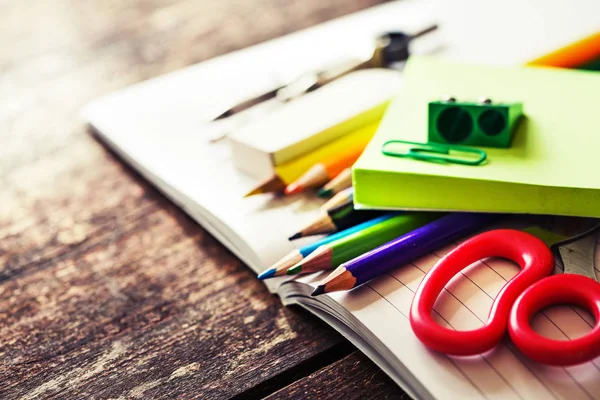 closeup view of different school supplies on wooden table