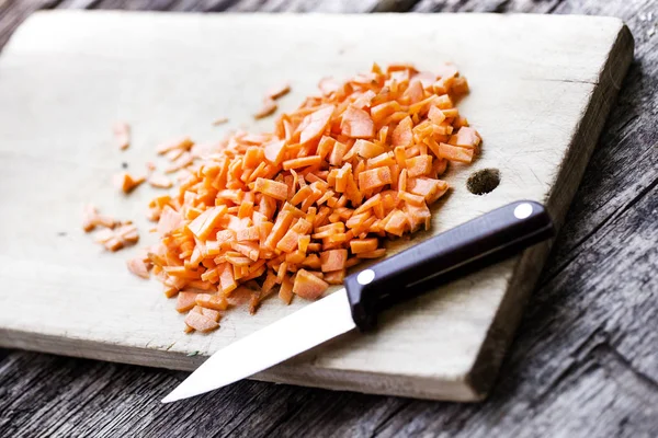 Diced carrots on a chopping board — Stock Photo, Image