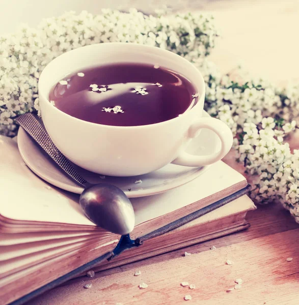 closeup view of fresh tea cup with books