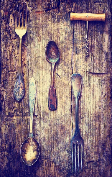 closeup view of vintage kitchen utensils over wooden table