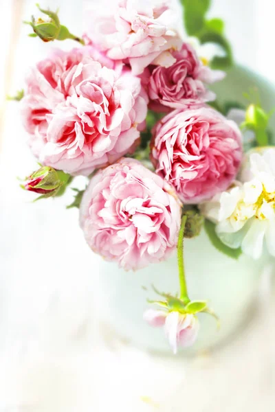 close-up of pink peony roses in vase