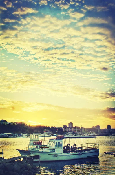 scenic view of harbor under sunrise