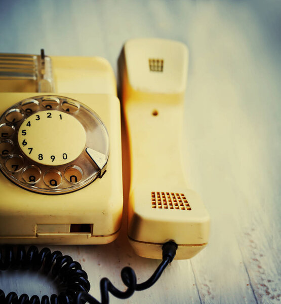 close up on retro telephone on table in vintage colors