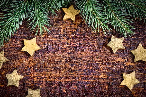 Fir Branches Christmas Decorative Stars Brown Wooden Background — Stock Photo, Image