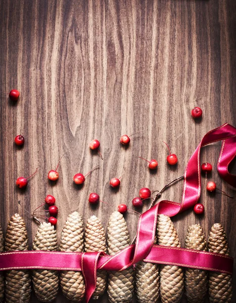 Pine Cones Wrapped Pink Ribbon Wooden Background — Stock Photo, Image