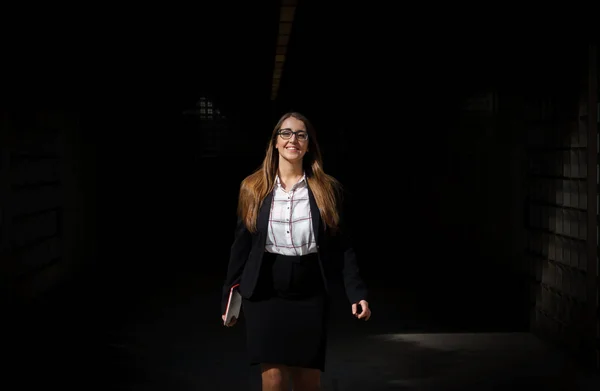 Woman walks out of tunnel with tablet pc — Stock Photo, Image