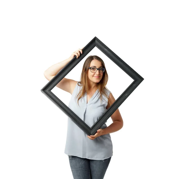 Woman with glasses behind crooked black frame — Stock Photo, Image