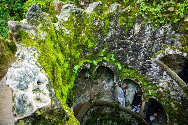 The Initiation Well pattern with blurred tourists in Sintra