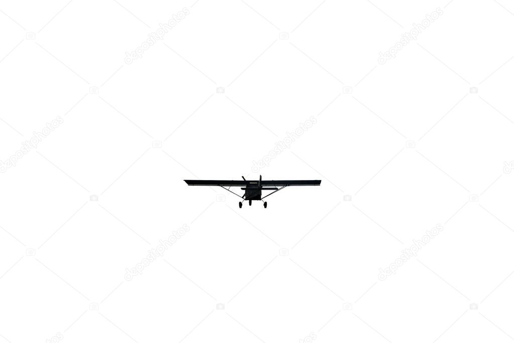 Light aircraft flying over white sky background