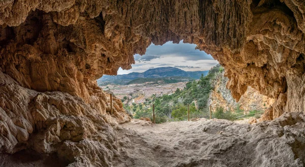 Almond tree in blossom valley from inside of the cave — Stock Photo, Image